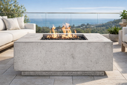 Outdoor studio patio with a fire pit table and ocean view