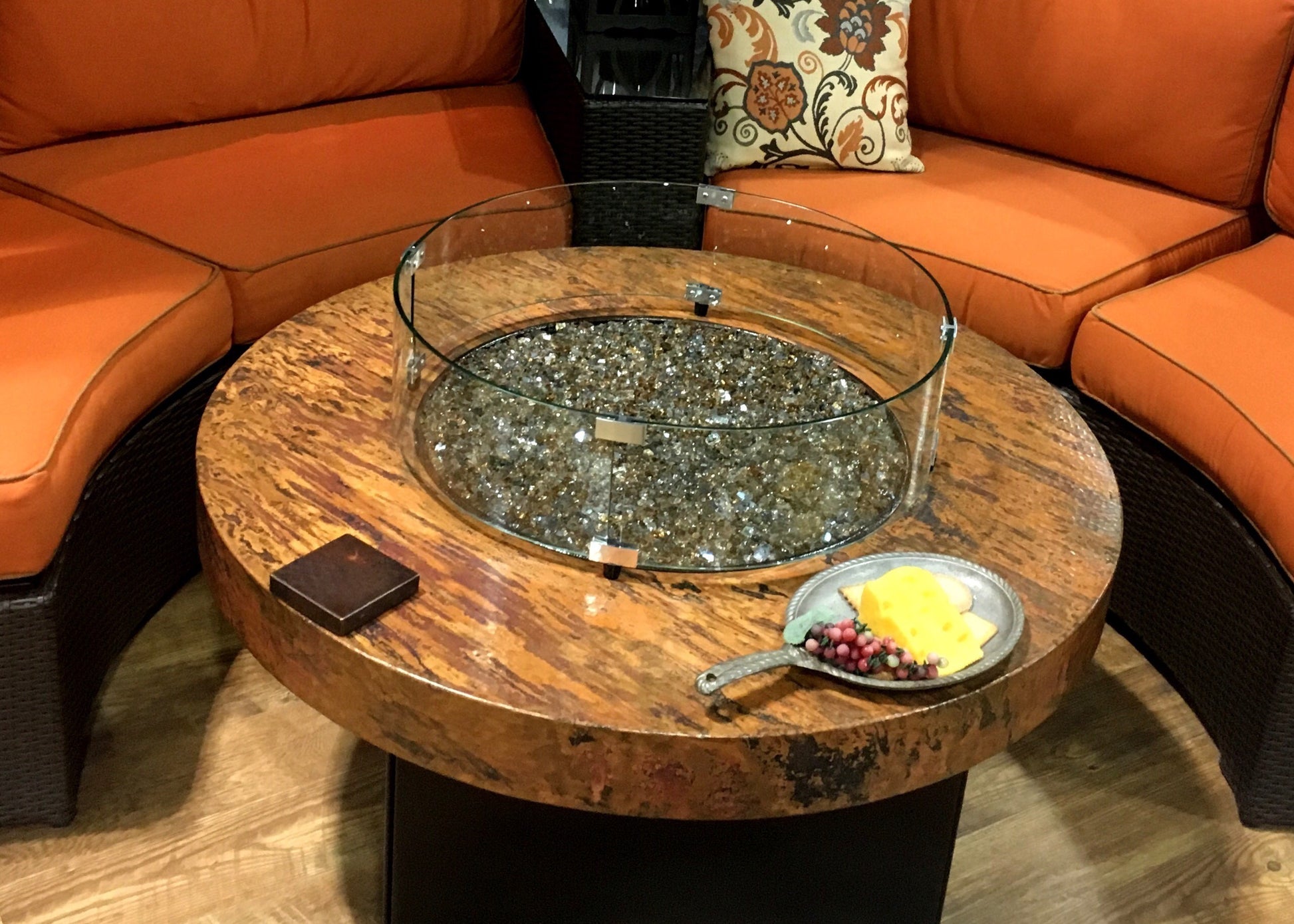 Oriflamme wind guard on acid wash Oriflamme hammered copper table